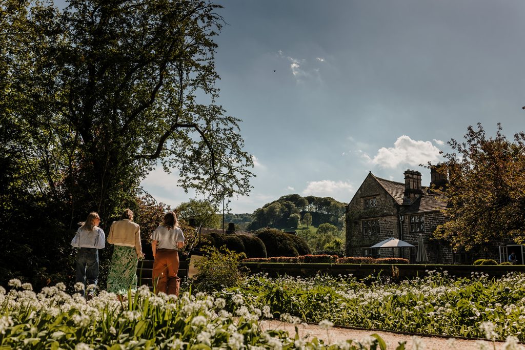 The Peacock at Rowsley in the sunshine for cocktails on the terrace or outdoor dining. Fine dining restaurant and hotel Derbsyhire Peak District Bakewell near Chatsworth
