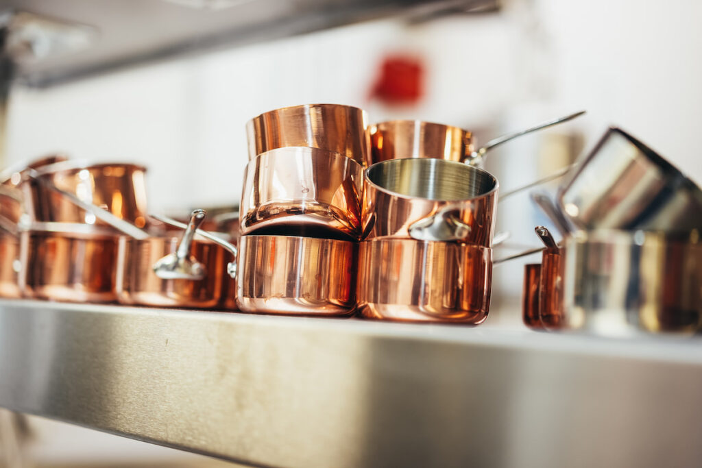 Kitchen-copper-pans-Peacock-at-Rowsley Copper pans in the kitchen at The Peacock at Rowsley